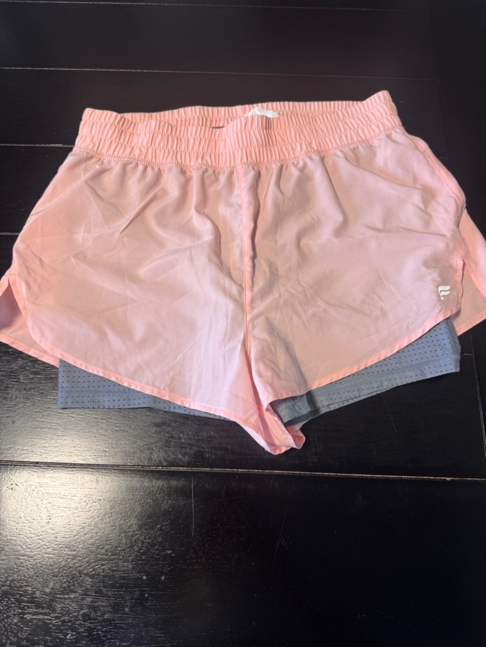 Fabletics Perforated 2” shirts in light capri coral and storm cloud size medium